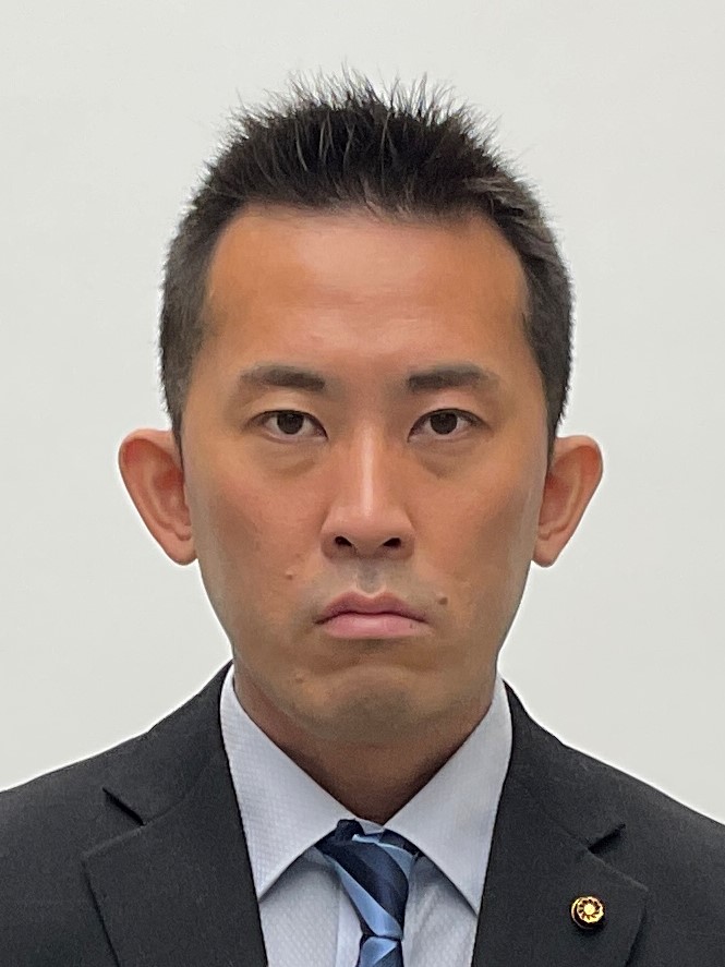 堤議員顔写真